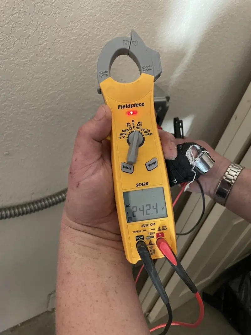 Voltage testing with clamp meter during Ceiling Fan Installation in Norwood